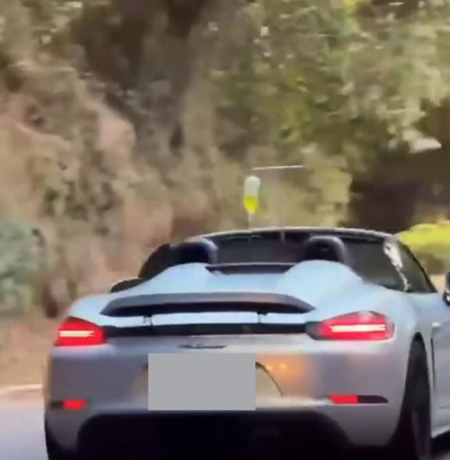 敞篷保時捷掛點滴上路引發討論　醫界示警恐影響行車安全